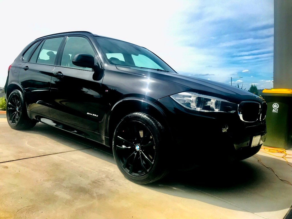 Glossy black BMW X5 with ceramic coating detailed by Shine Your Ride, Canberra
